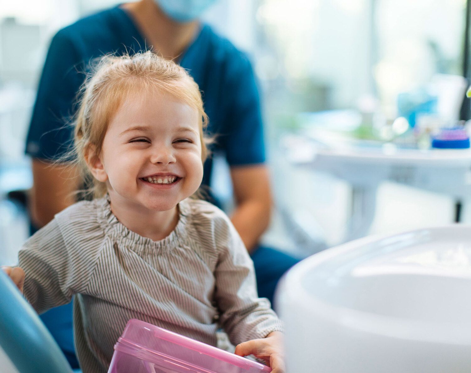 Dentist consulting with parent and child