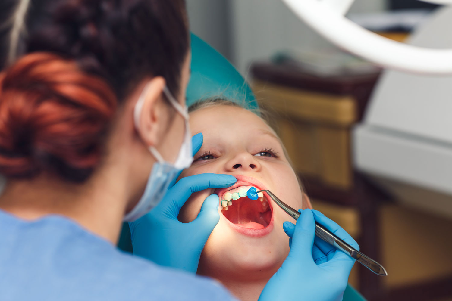 Child getting fluoride treatment