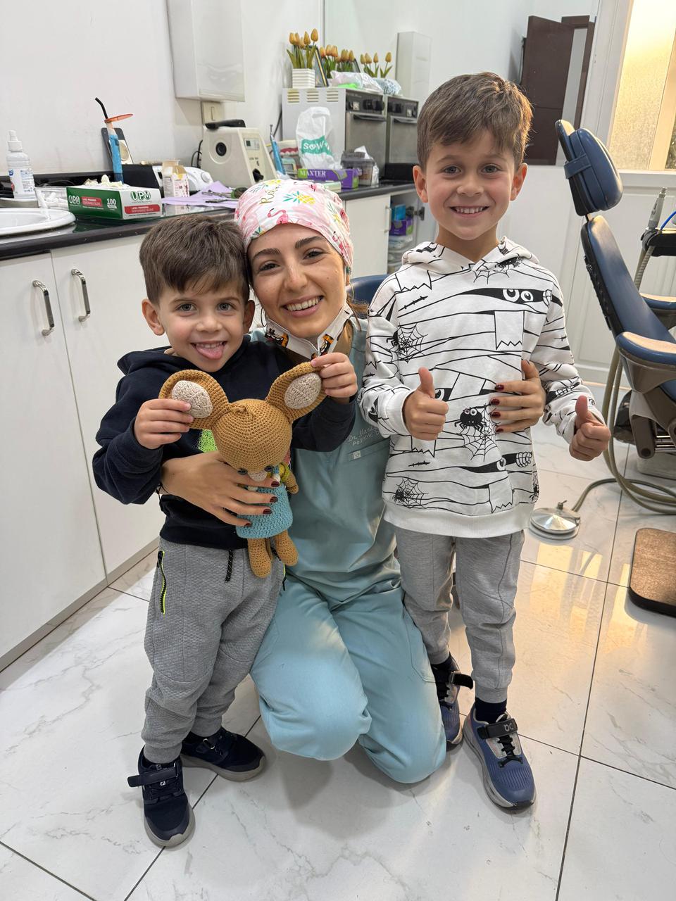 Dr. Marilyn Nohra with two young patients after their check-up in Achrafieh, Beirut