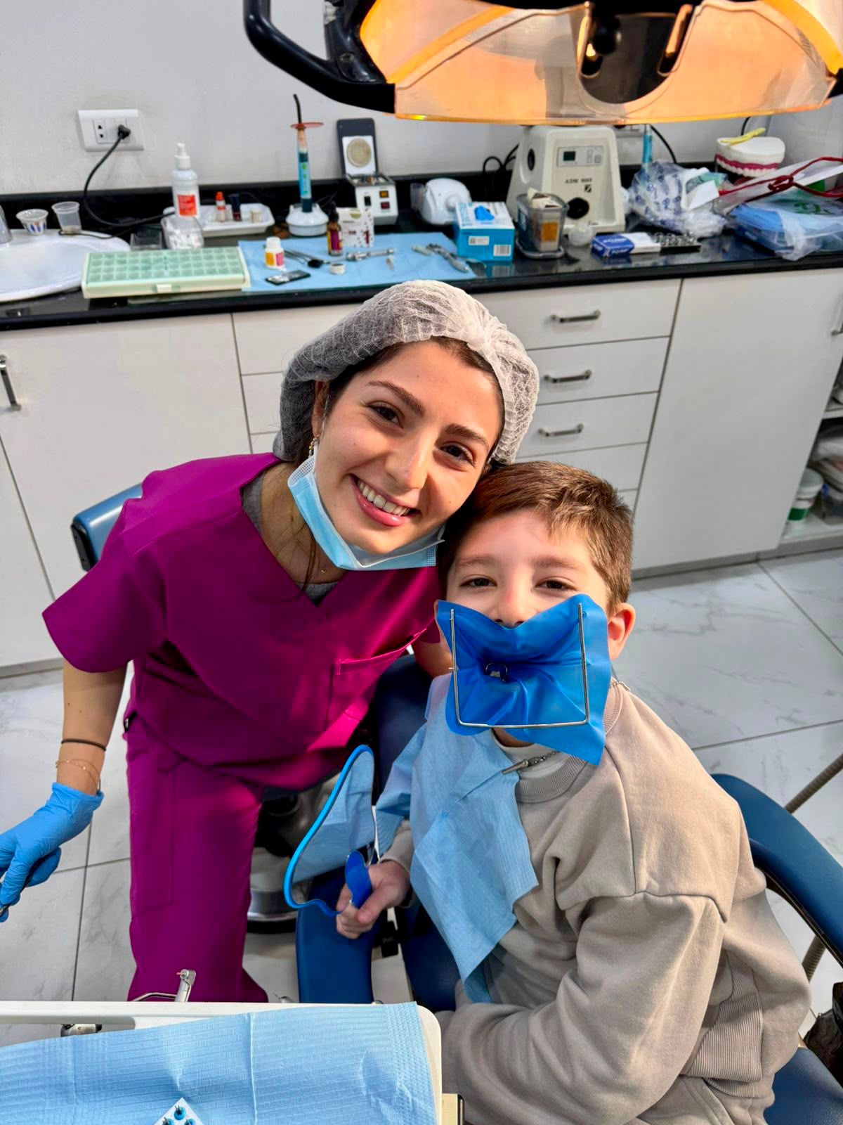 Child being treated with a rubber dam at Mario Nohra Dental Clinic in Achrafieh, Beirut