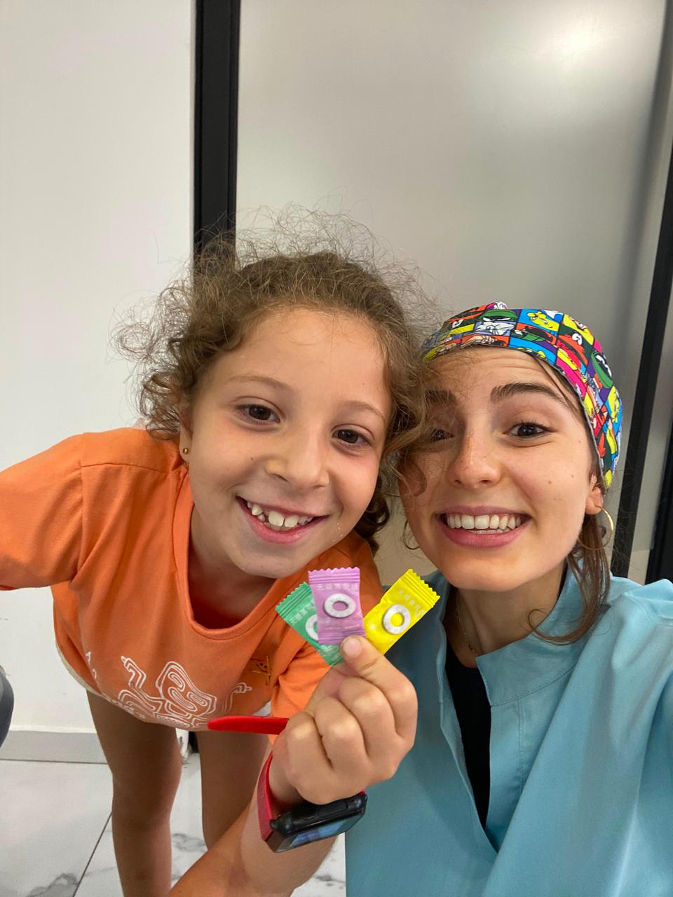 Girl choosing her reward after a pediatric dental visit in Achrafieh
